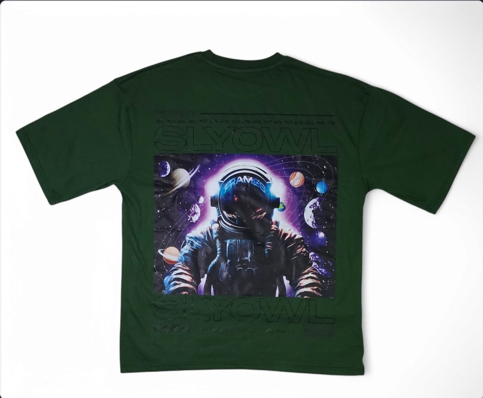 a green colored t-shirt with a graphic of an astronaut and a galaxy behind them