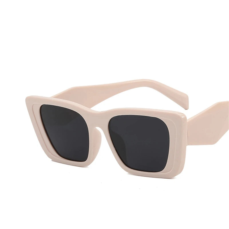 light-pink cat-eye glasses with tinted lenses