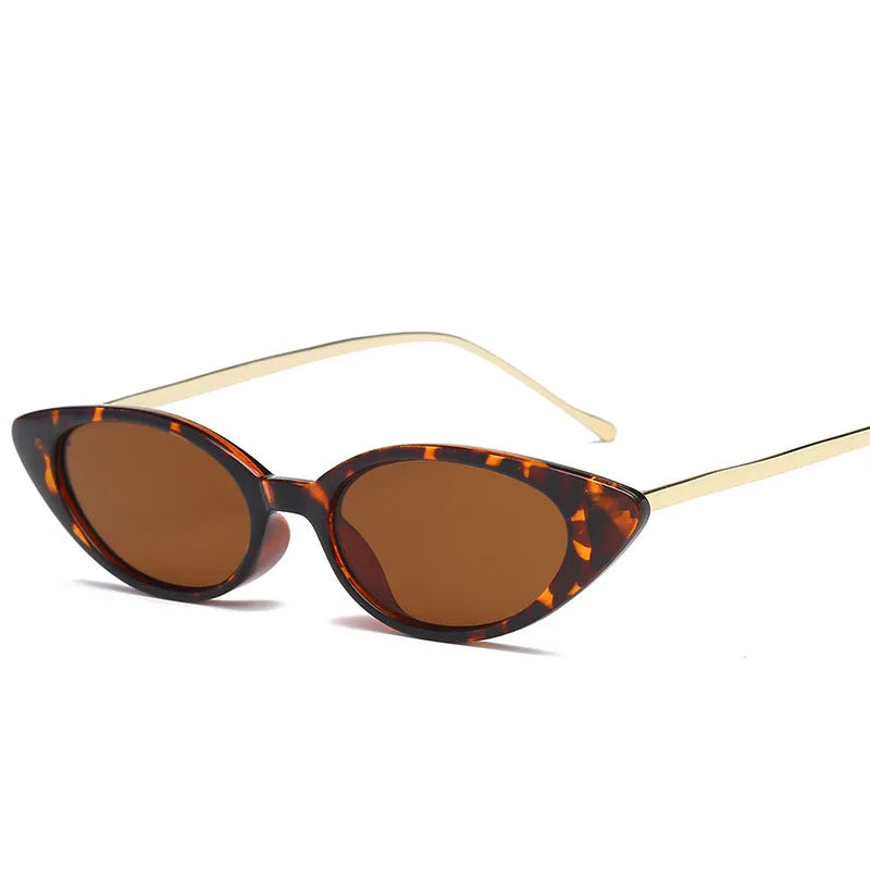 red and orange speckled eyeglasses with gold trim
