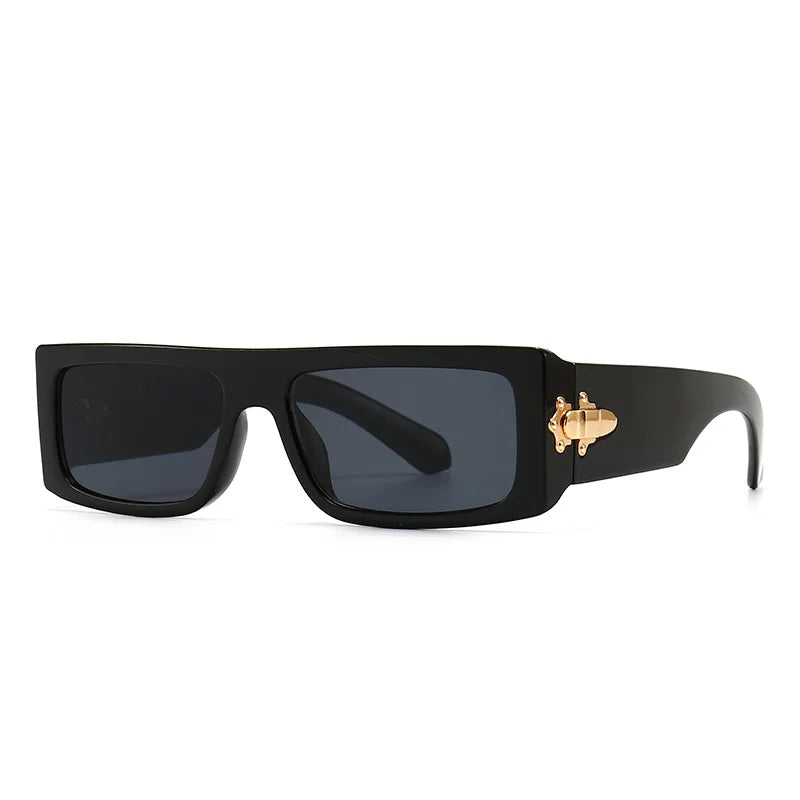 Black sunglasses with a gold accent on a white background