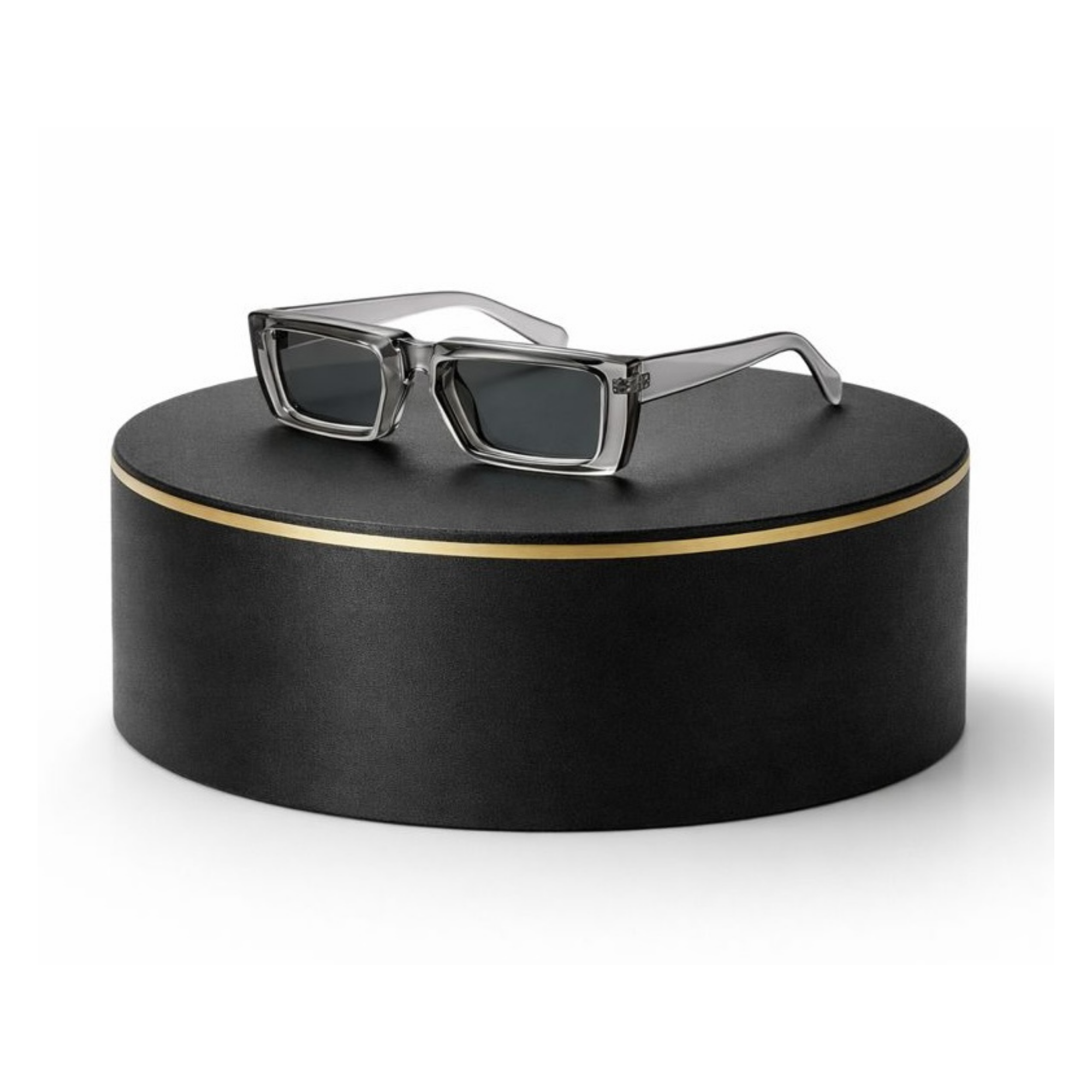 Sunglasses on a black round surface with a gold rim